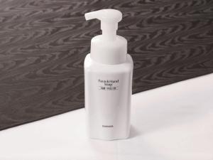 a white bottle of liquid soap sitting on a counter at APA Hotel Shibuya Dogenzakaue in Tokyo