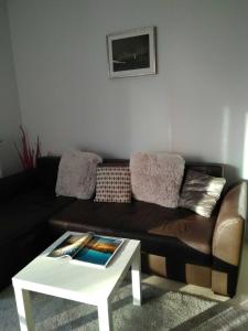 a living room with a couch and a coffee table at Manufaktura in Warsaw