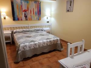 Cama o camas de una habitación en Hosteria Doña Conchi
