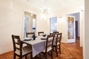 a dining room with a table and chairs at Modern Apartments in Krakow