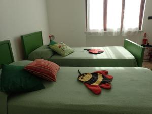 Posteľ alebo postele v izbe v ubytovaní Casetta tra gli Ulivi vicina al Mare