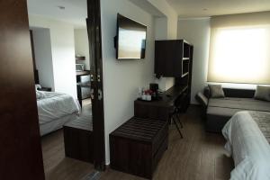 Voodi või voodid majutusasutuse Lithio Hotel toas