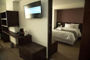 Voodi või voodid majutusasutuse Lithio Hotel toas