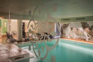 a living room with a table and a dining room at Mediterraneo Emotional Hotel & Spa in Santa Margherita Ligure