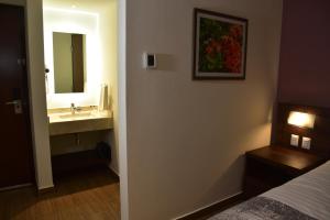 Voodi või voodid majutusasutuse Lithio Hotel toas