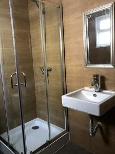 a bathroom with a shower and a sink at Mountain and Sea in Ribeira Grande