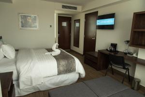 Voodi või voodid majutusasutuse Lithio Hotel toas
