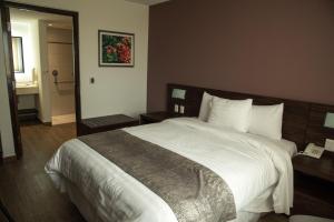 Voodi või voodid majutusasutuse Lithio Hotel toas