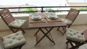 A balcony or terrace at Kallopsia - Glifada Beach Menigos Resort by New Era