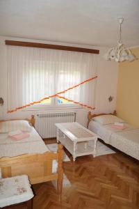 Ένα ή περισσότερα κρεβάτια σε δωμάτιο στο Apartment Drago