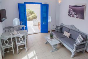 a living room with a couch and a table at Cultural House in Pyrgos
