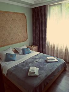 Ένα ή περισσότερα κρεβάτια σε δωμάτιο στο Apartments Sunset Paradise