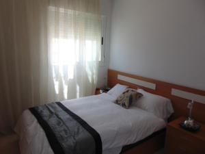 Postel nebo postele na pokoji v ubytování Marina d’Or Beachfront-Vista al mar frontal + 22 fotografií