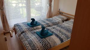Posteľ alebo postele v izbe v ubytovaní Apartment Balaton