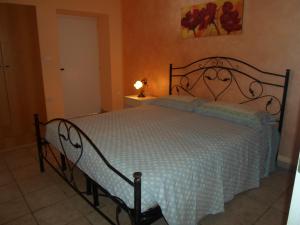 A bed or beds in a room at Villa Martina nel Salento