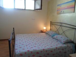 A bed or beds in a room at Villa Martina nel Salento