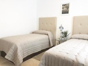 Voodi või voodid majutusasutuse Stylish apartment perfect location toas