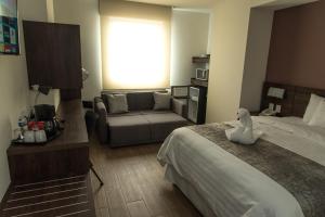 Voodi või voodid majutusasutuse Lithio Hotel toas