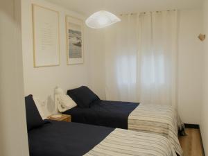 Ένα ή περισσότερα κρεβάτια σε δωμάτιο στο Apartamento Lapamán