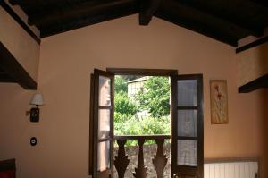 an open door to a balcony in a house at La Cuestecilla in Hervás
