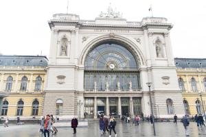 a large building with people walking in front of it at Cozy Apartment Budapest in Budapest