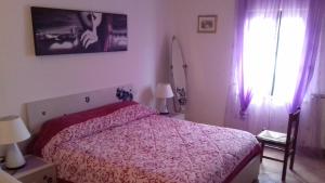 Кровать или кровати в номере Villa L'Oliveto