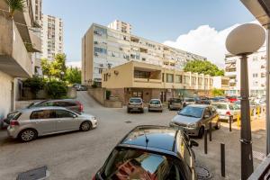 a group of cars parked on a city street at Studio Apartment Nikol in Split