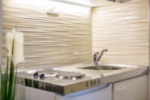 a kitchen with a sink and a counter top at Studio Apartment Nikol in Split