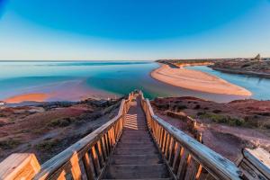 a stairway leading down to a body of water at Coast Motel and Apartments in Port Noarlunga