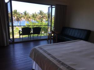 Postel nebo postele na pokoji v ubytování Coconut Beach Homestay