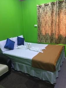 Säng eller sängar i ett rum på Hero Phuket