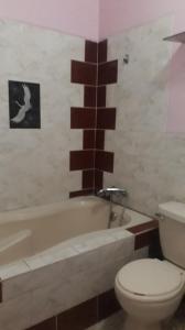 Ett badrum på Hospedaje Harjeny