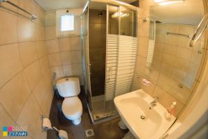 a bathroom with a toilet and a sink and a shower at The L Villa in Nea Peramos +47 photos