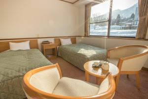 Postel nebo postele na pokoji v ubytování Refre Hotel