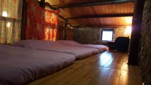 A bed or beds in a room at Furen Homestay