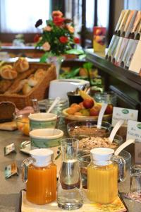 a table topped with lots of different types of honey at Frühstückspension Binder in Harbach