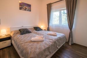 Katil atau katil-katil dalam bilik di Apartments Laura