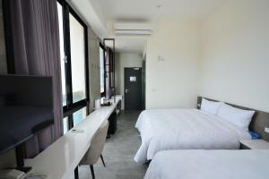 Rúm í herbergi á Sky Square Business Travel