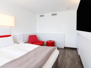 מיטה או מיטות בחדר ב-DORMERO Hotel Stuttgart