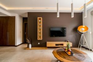 TV a/nebo společenská místnost v ubytování Apartments Magic Sea View