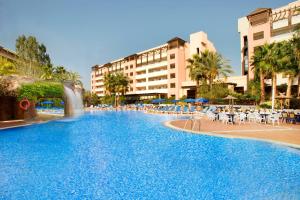 a large swimming pool in a large city at H10 Salauris Palace in Salou