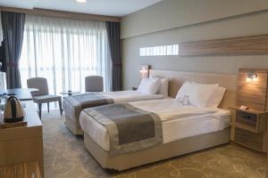 Postel nebo postele na pokoji v ubytování Greymark Hotel + 29 fotografií