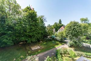 an overhead view of a yard with trees and a house at Sunny Suite in Center of Sopot in Sopot