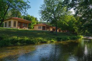 a house on a hill next to a river at Perperеshka River Villas in Stremtsi