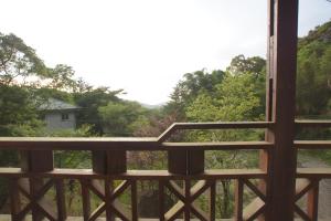 A balcony or terrace at Fumei Bluebird Homestay