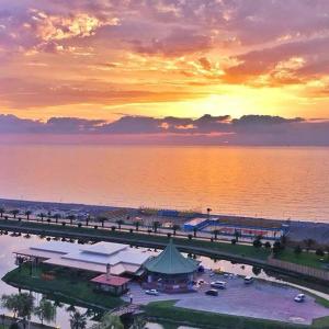 a view of a marina with a bridge over the water at Roini Apartment in Batumi