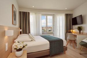 Cama ou camas em um quarto em Hotel Suisse