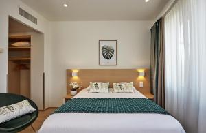 Cama ou camas em um quarto em Hotel Suisse