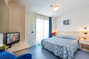 Postel nebo postele na pokoji v ubytování Hotel Minerva