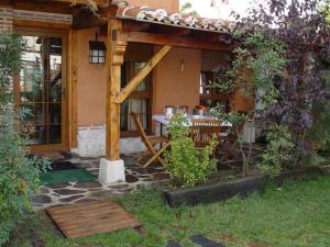 a house with a table in the yard at Hospedium Hacienda Las Cavas in Olmedo +118 photos